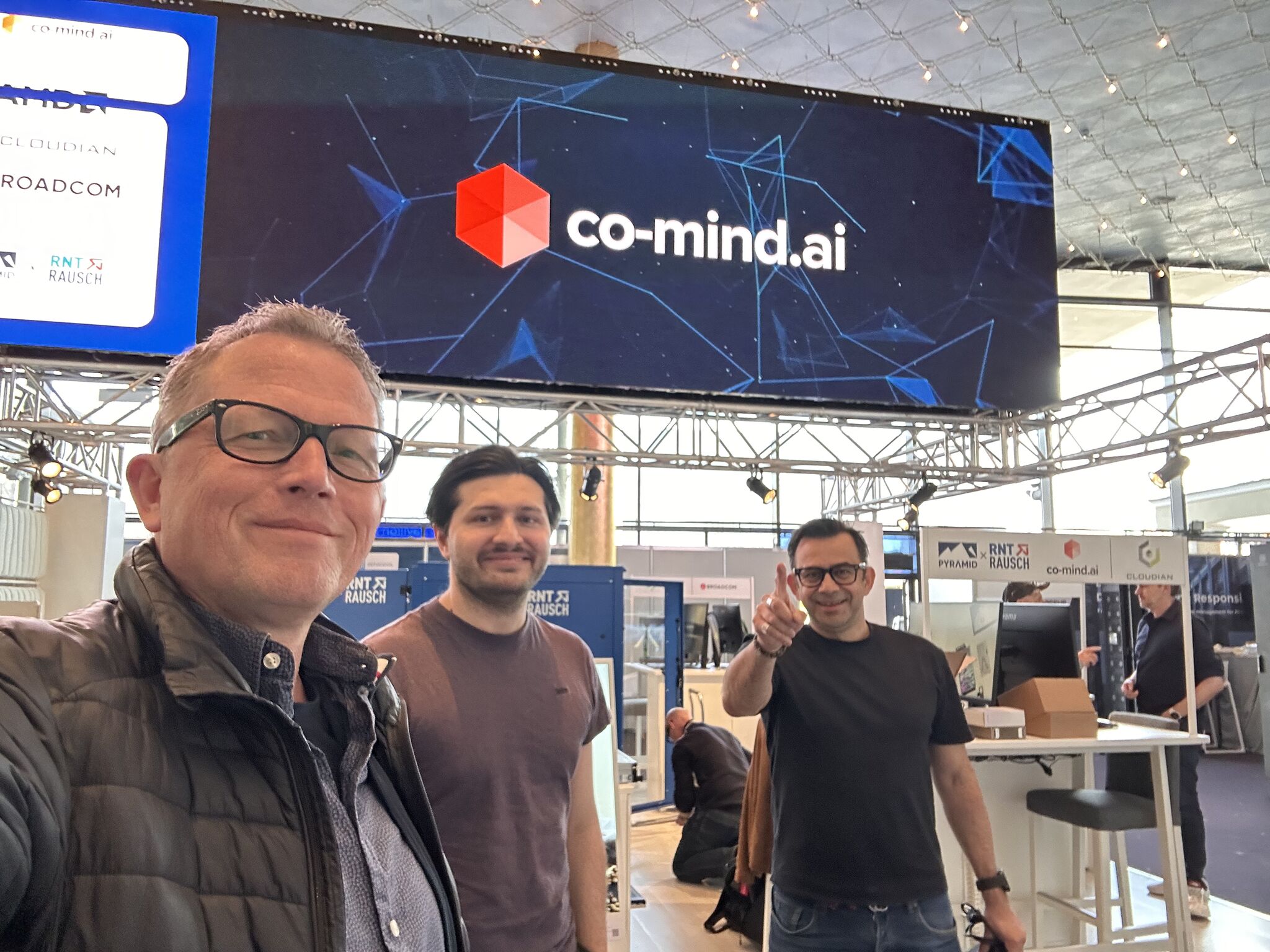 The co-mind.ai team at CloudFest 2026 — Ralph de Wargny, Ralf Steinemann, Levent Akyil